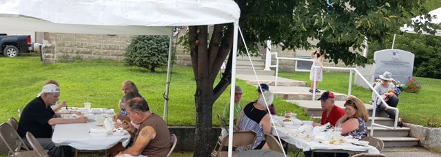 people eating at bean supper